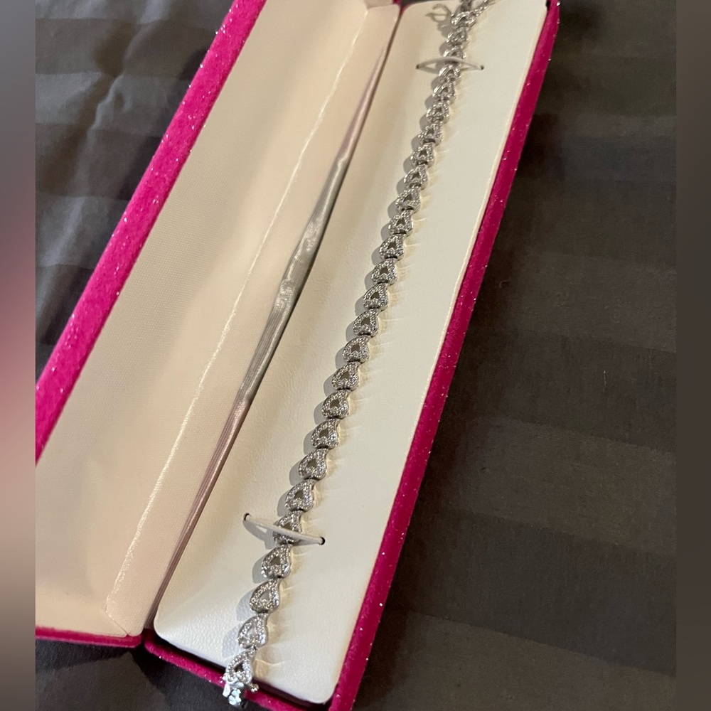 Beautiful sterling silver diamond heart shaped bracelet.